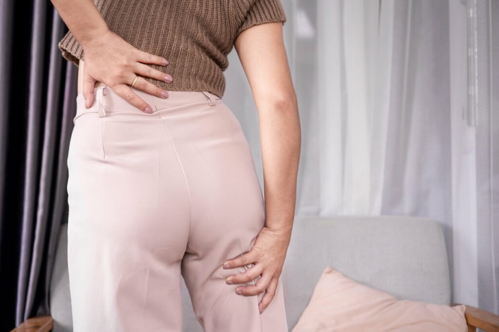 a woman suffering from sciatica pain