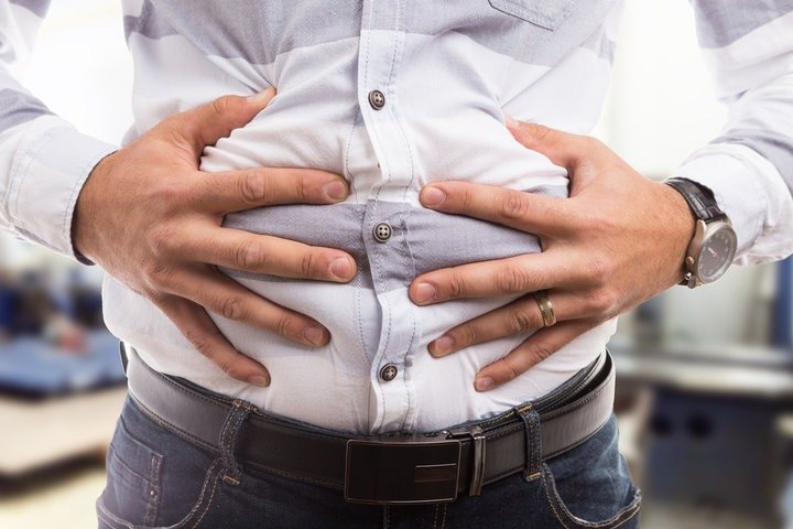 a man with bloating stomach 